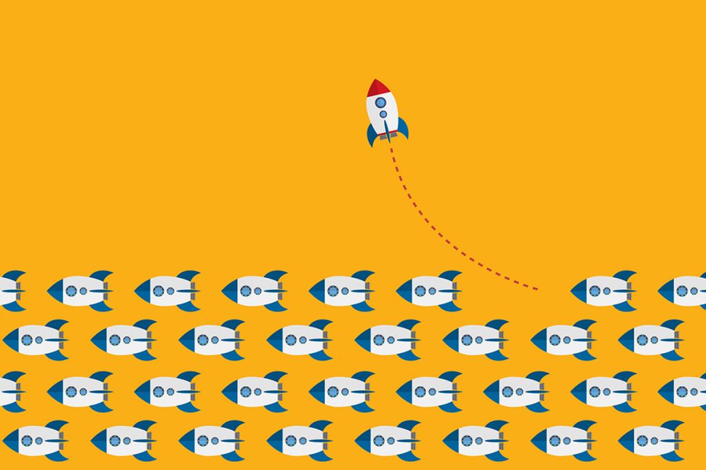 Colorful holiday real estate postcards displayed on a desk