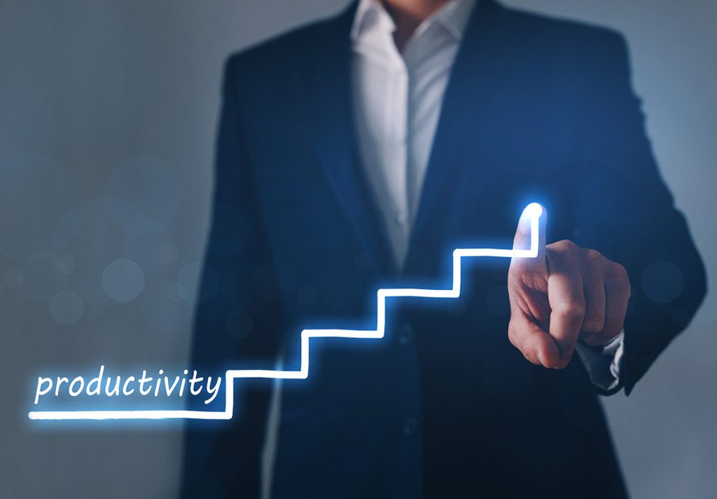 Real estate broker coaching an agent on productivity strategies