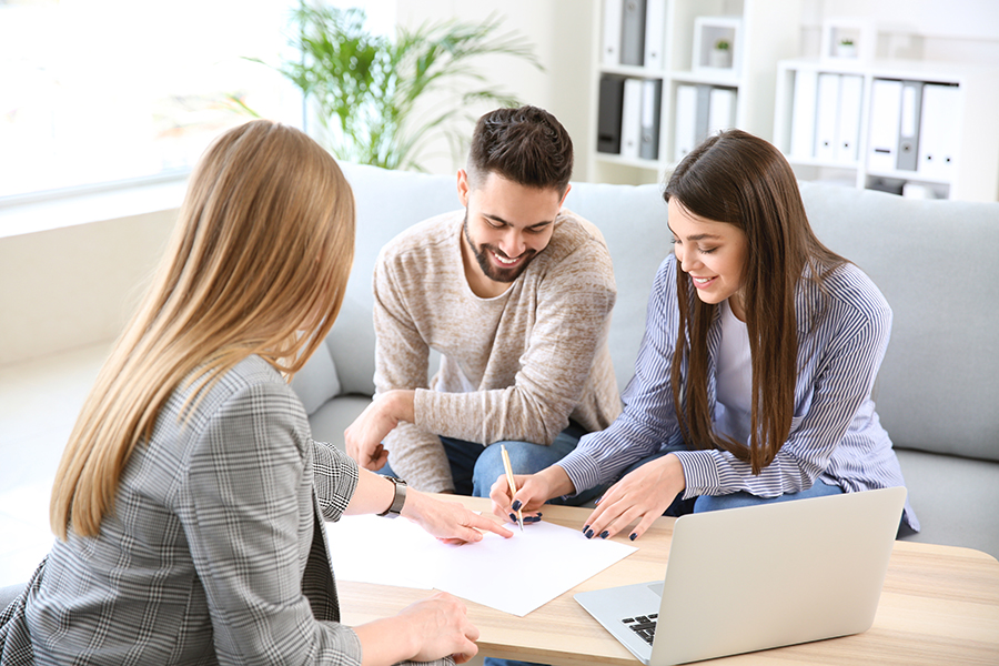 Real estate agent on a laptop preparing for a listing appointment