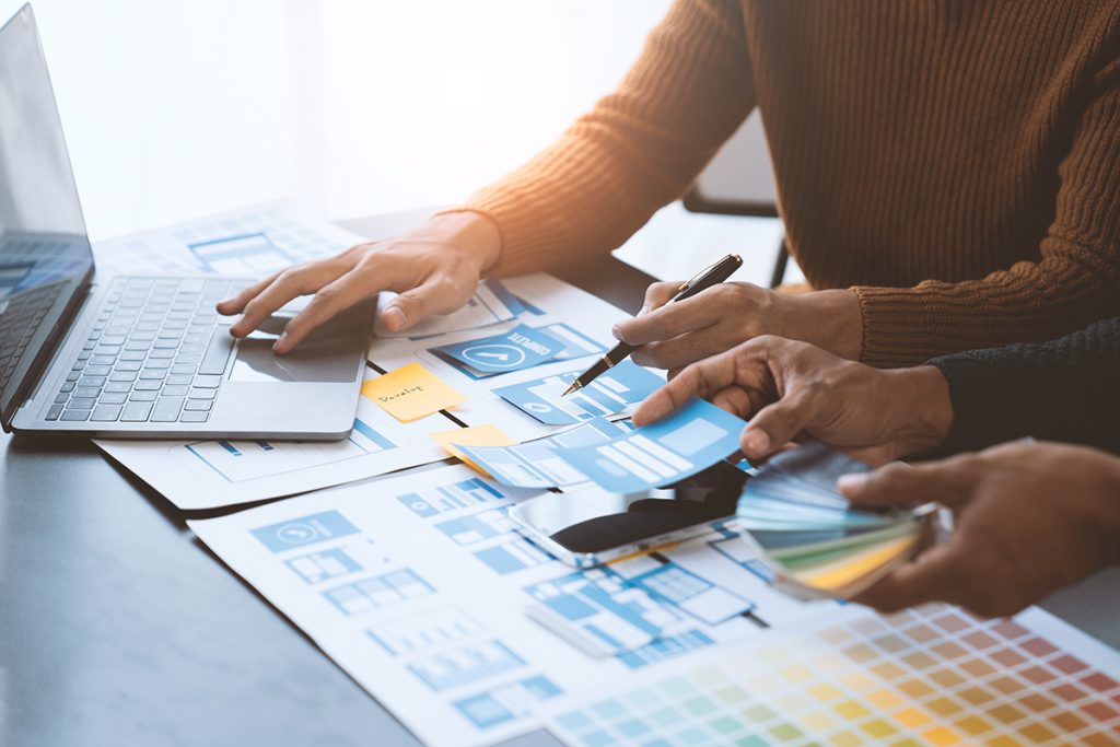 Branded real estate postcard campaign materials laid out for review