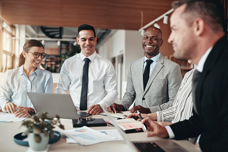 Various professionals meeting around a table in an office